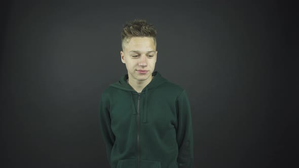 Man with Fashionable Spiky Hairstyle Nods Head at Audition