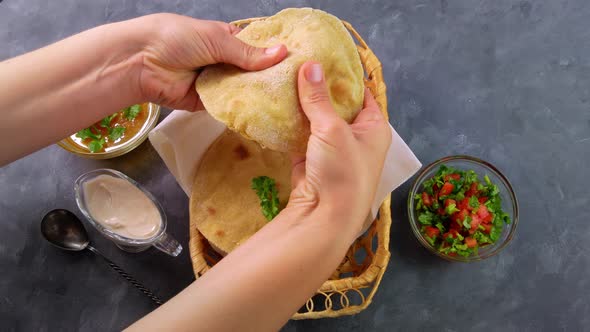 Homemade corn flatbread female hands cilantro green tomato salsa Handmade mexican tortilla vegetable