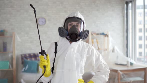 Young Woman Disinfector or Cleaning Company Looking Into the Camera