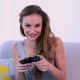 Smiling Model Playing Video Games On The Couch - VideoHive Item for Sale