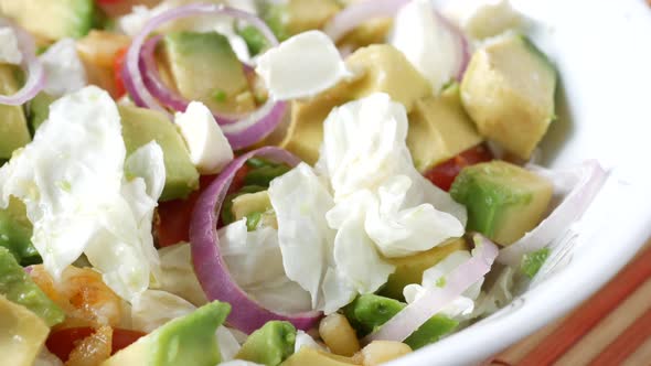 Young Women Eating Avocado Salad