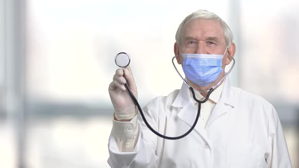 Stethoscope in Senior Doctor's Hand