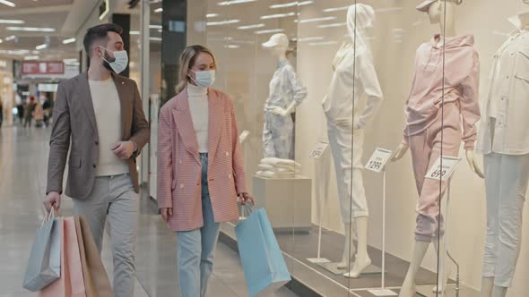 Couple Shopping For Clothes During Coronavirus