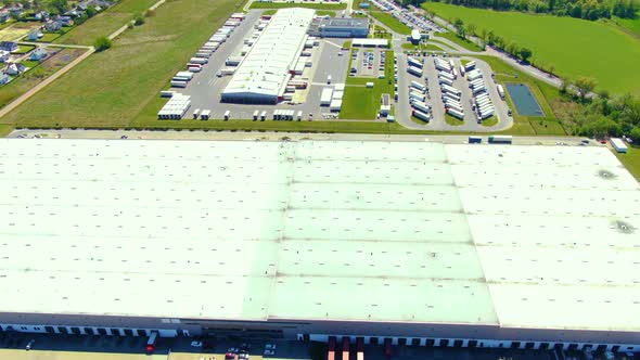 Aerial view of warehouse storages or industrial factory or logistics center from above. Top view of