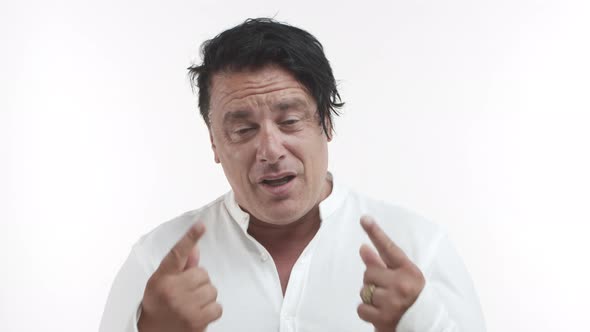 Closeup of Middleaged Italian Man in White Casual Tshirt Asking for Last Chance Explaining Himself