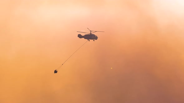 Helicopter Flying Over Wildfire