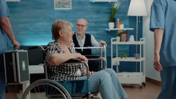 Disabled Woman Getting Medical Visit for Checkup From Nurse