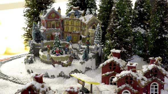 Toy Christmas city with training under snow. Flat plane