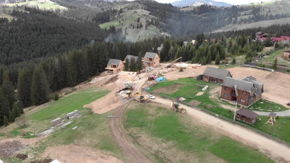 Heavy machinery working on construction site at mountain ski resort