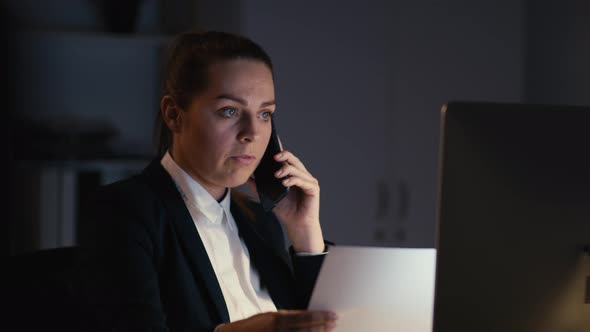 Caucasian businesswoman working to late at the office. Shot with RED helium camera in 8K.