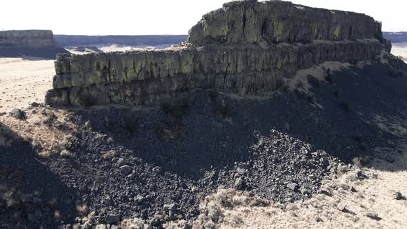 Pull back and reveal the central butte at Sun Lakes-Dry Falls State Park, Washington, aerial