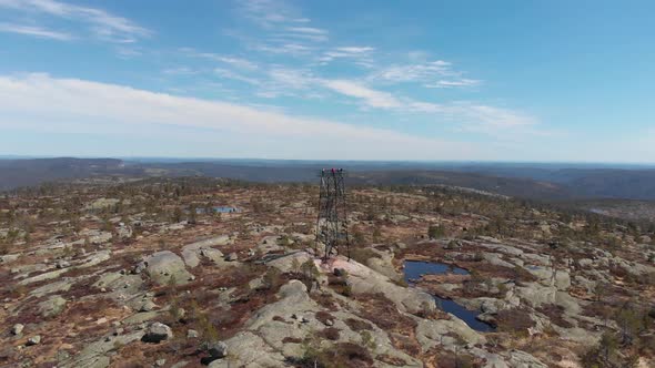 Aerial Drone View Of A Lookout Tower Surrounded With Semi-Arid Landscape In Norway.
