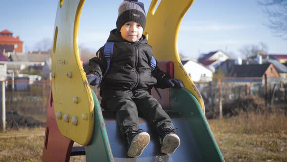 Little Boy Have Fun on the Playground.