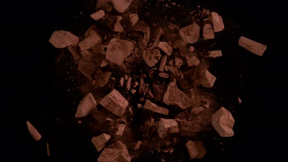 Super Slow Motion Shot of Rotating Chocolate Chunks and Cocoa Powder Explosion at 1000Fps alt