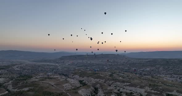 Aerial Cinematic Drone View of Colorful Hot Air Balloon Flying Over Cappadocia