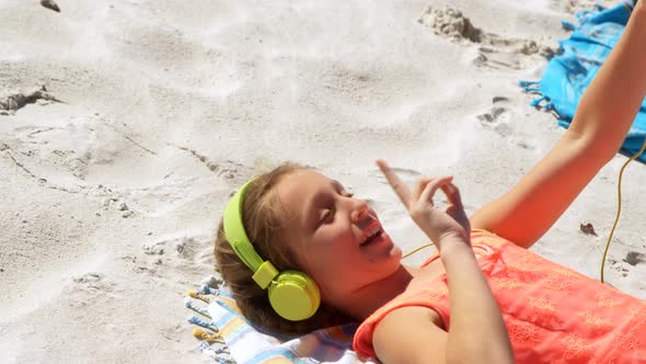 Girl taking selfie with mobile phone in the beach 4k