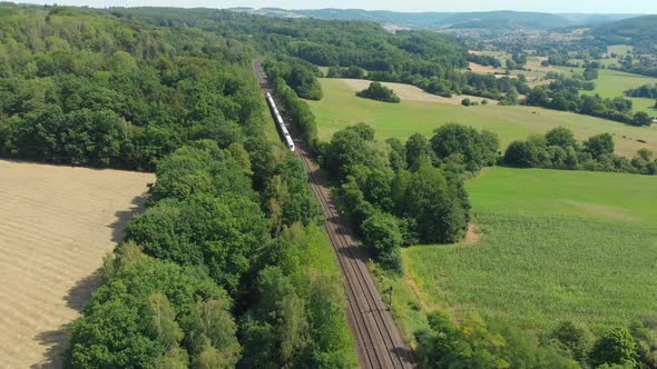 inter city express train cutting through countryside