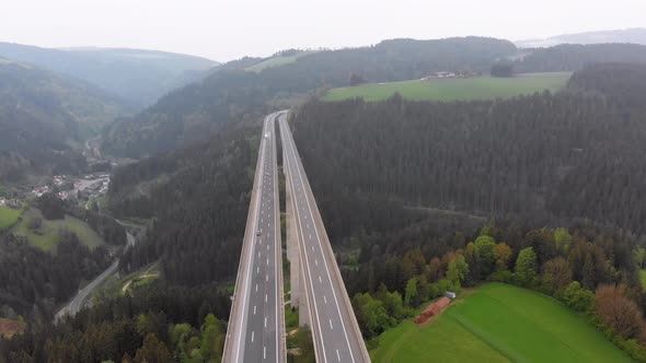 Aerial View of the Highway Viaduct on Concrete Pillars in the Mountains