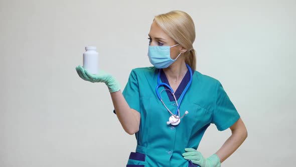 Medical Doctor Nurse Woman Wearing Protective Mask - Holding Can of Pills or Vitamins