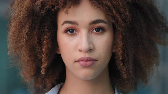 Extreme Closeup Female Upset Face Head with Stylish Makeup Afro Hairstyle Outdoors Portrait African