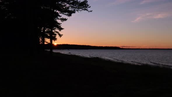 Sunset time lapse over the forest and sea