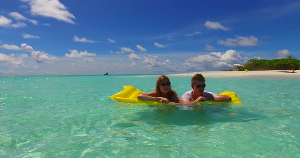 Happy people in love dating on vacation enjoy life on beach on white sand background 