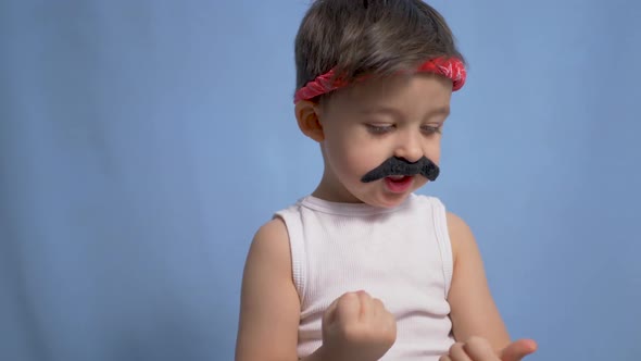 Funny Mexican Boy with a Big Black Mustache and a White t Shirt