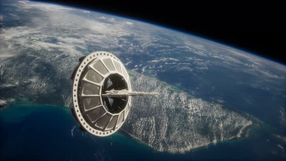 Futuristic Space Satellite Orbiting the Earth alt