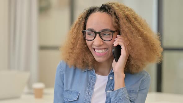 Portrait of African Woman Talking on Smartphone