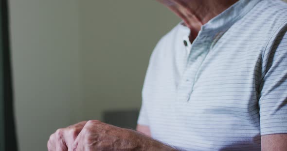 Portrait of senior caucasian man sitting at home