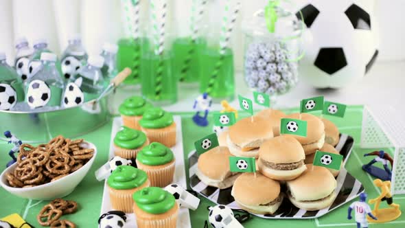 Kids football party set with snacks and drinks.