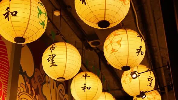 Paper Lanterns Shining on Street. Beautiful Paper Lanterns Shining While Hanging in Narrow Passage