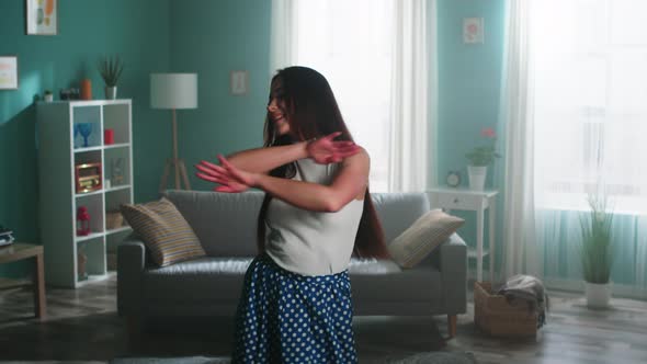 Woman Is Dancing and Amusing Herself In Living Room