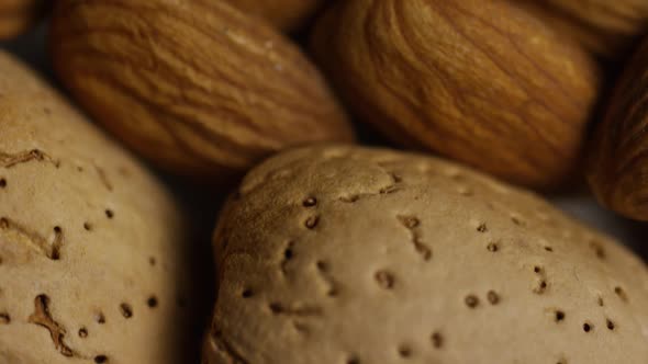 Cinematic, rotating shot of almonds on a white surface - ALMONDS 