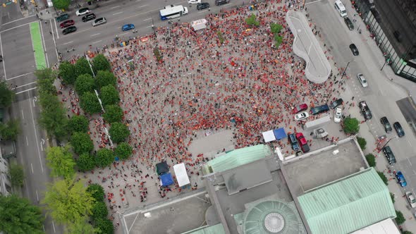 Huge crowd of Native protesters assemble below, pull back tilt aerial