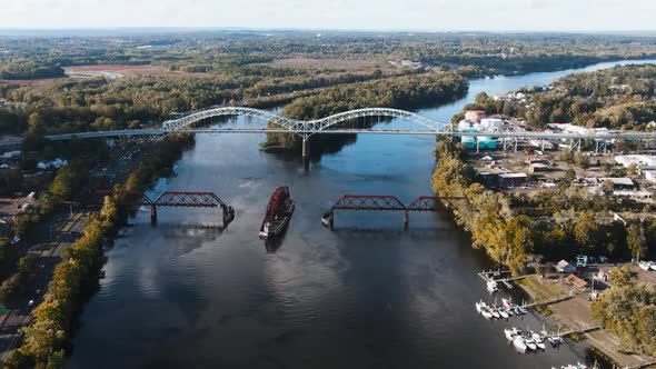 Great overview drone shot of Arrigoni Bridge in Middletown, Connecticut and the nearby rotating rail