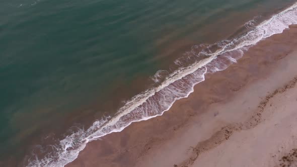 Ocean waves hitting on sandy beach. tropical sea landscape. Sea sunrise on beach.