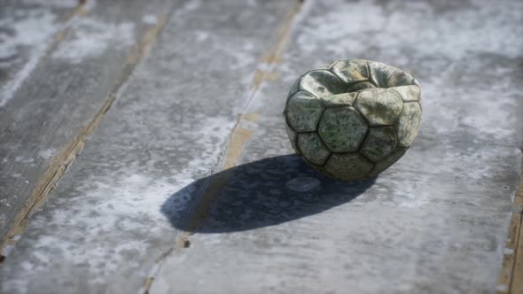 Old Soccer Ball the Cement Floor