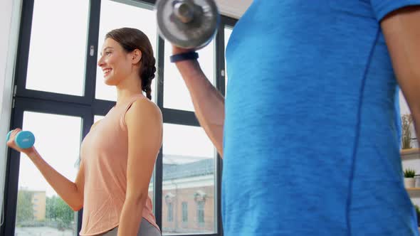 Happy Couple Exercising at Home