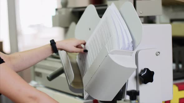 Alignment of Stack of Paper Documents in Printing House in Shaking Folder