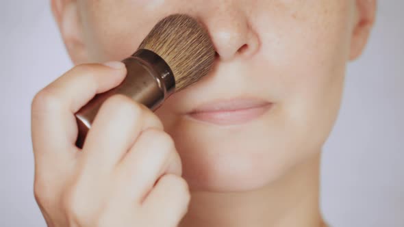 Close Up Face Young Woman Powdering