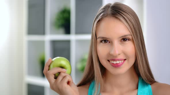 Closeup Face of Charming Vegetarian Girl Smiling Posing with Green Vitamin Apple Looking at Camera