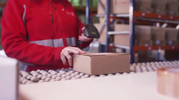 Anonymous worker scanning packages in warehouse
