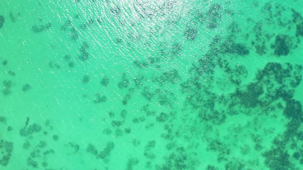 Aerial flying over tourism of paradise seashore beach holiday by turquoise ocean and white sand back