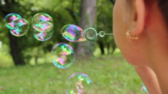 Little Girl Making Bubbles