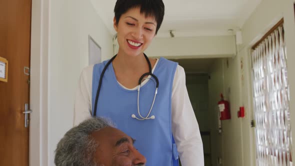 Nurse helping a senior man in retirement house