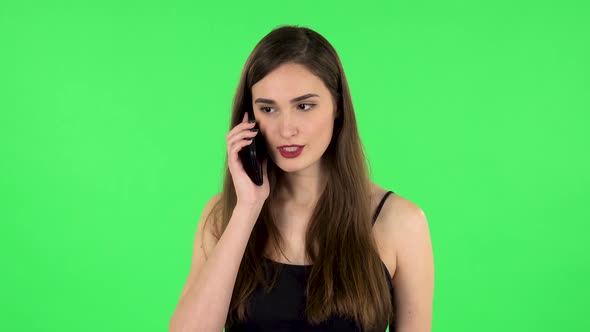 Girl Talking for Mobile Phone, Very Shocked. Green Screen