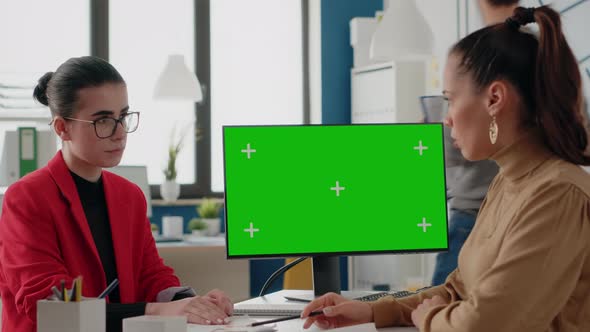 Coworkers Working with Green Screen on Monitor