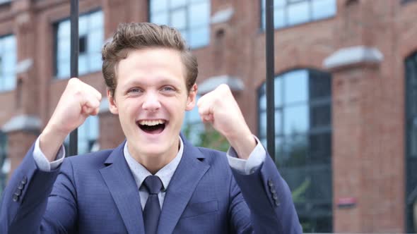 Successful Excited Businessman Celebrating Success, Standing Outdoor