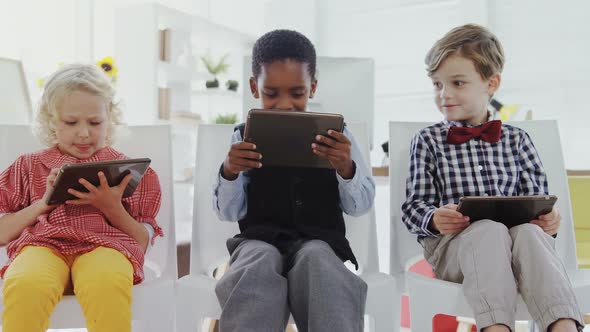 Kids as business executives using digital tablet 4k